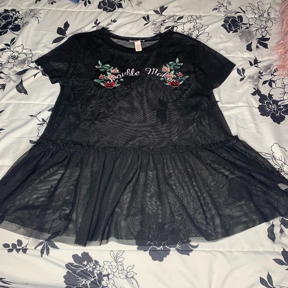 Sheer black top with graphic.